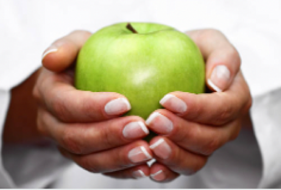 Green apple held in hands 
