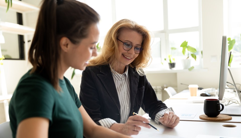 Two women working together