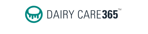 Caregiver and cow in dairy farm