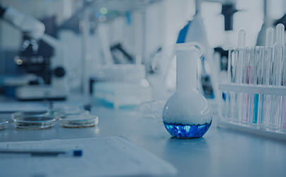 A laboratory with a beaker, test tubes, and scientific equipment.